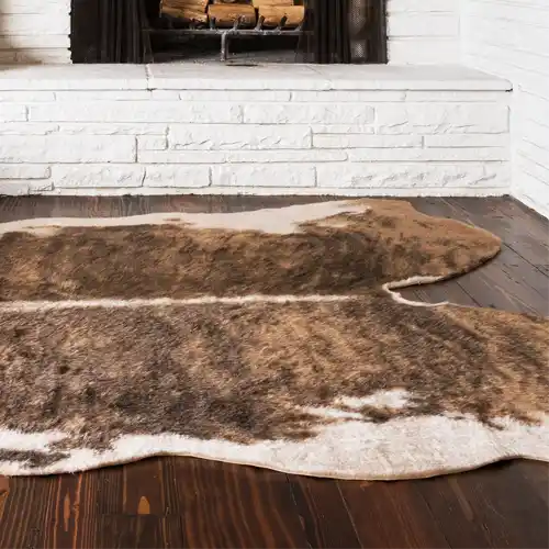 tan cowhide rug